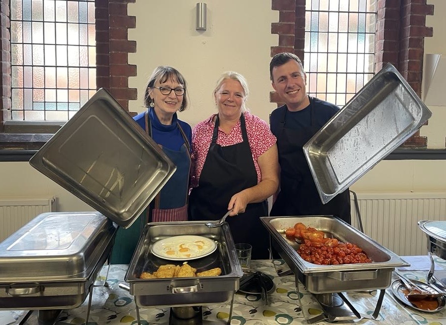 People serving food at the Oxhey Village Big Breakfast 2013