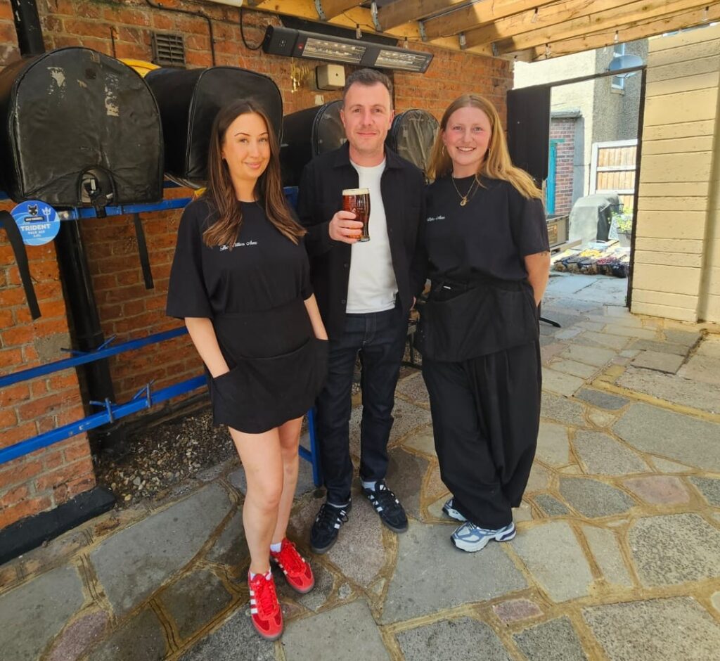 Rob Kirby Chair of Oxhey Village Environment Group with staff from The Villiers Arms pub at Oxhey Village Brewfest 2026