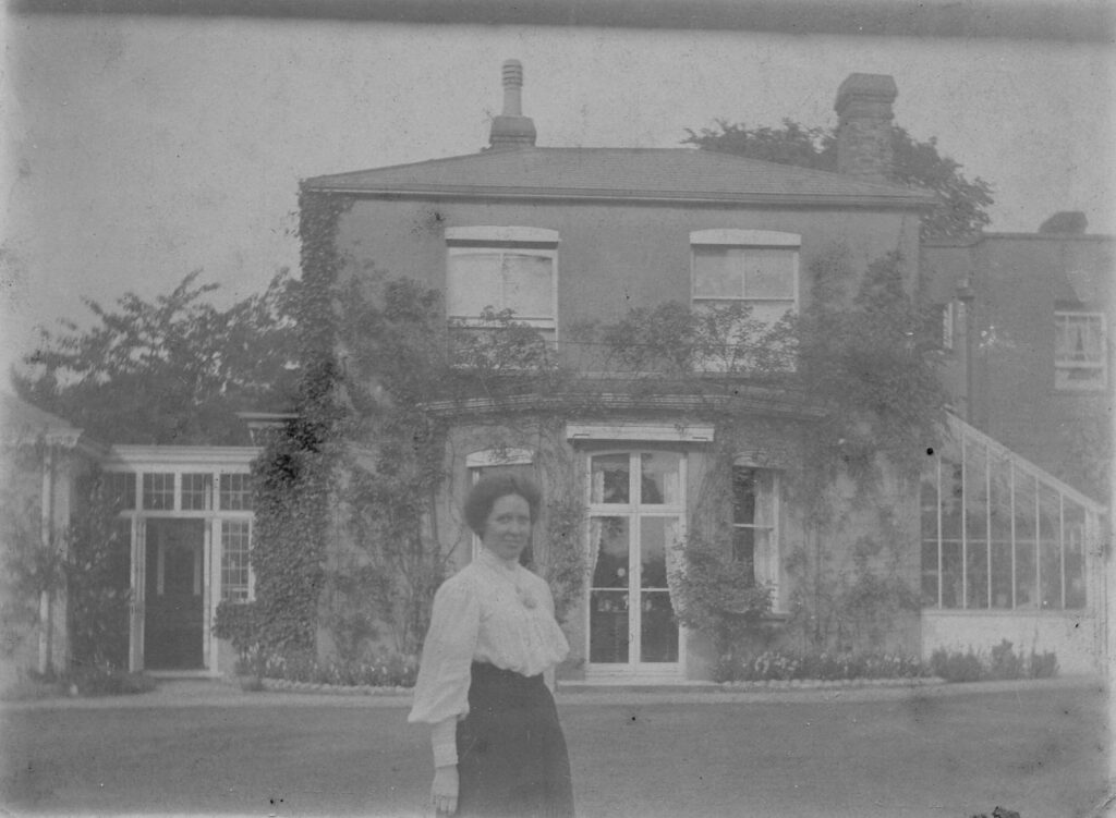 Artist Mary Pownall Bromet stood outside her house Lime Lodge in Oxhey Village