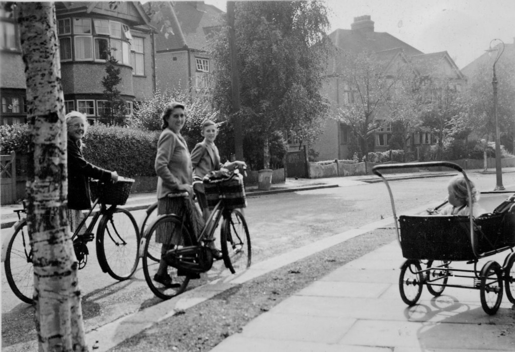 Women pushing bicycles, alongside a pram on Talbot Avenue, circa 1945. Image: Oxhey Village Environment Group
