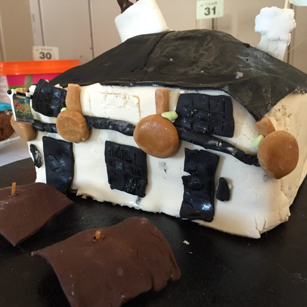 A cake in the shape of the Rifle Volunteer pub at OVEG's Oxhey Village Bake Off on 17 May 2015