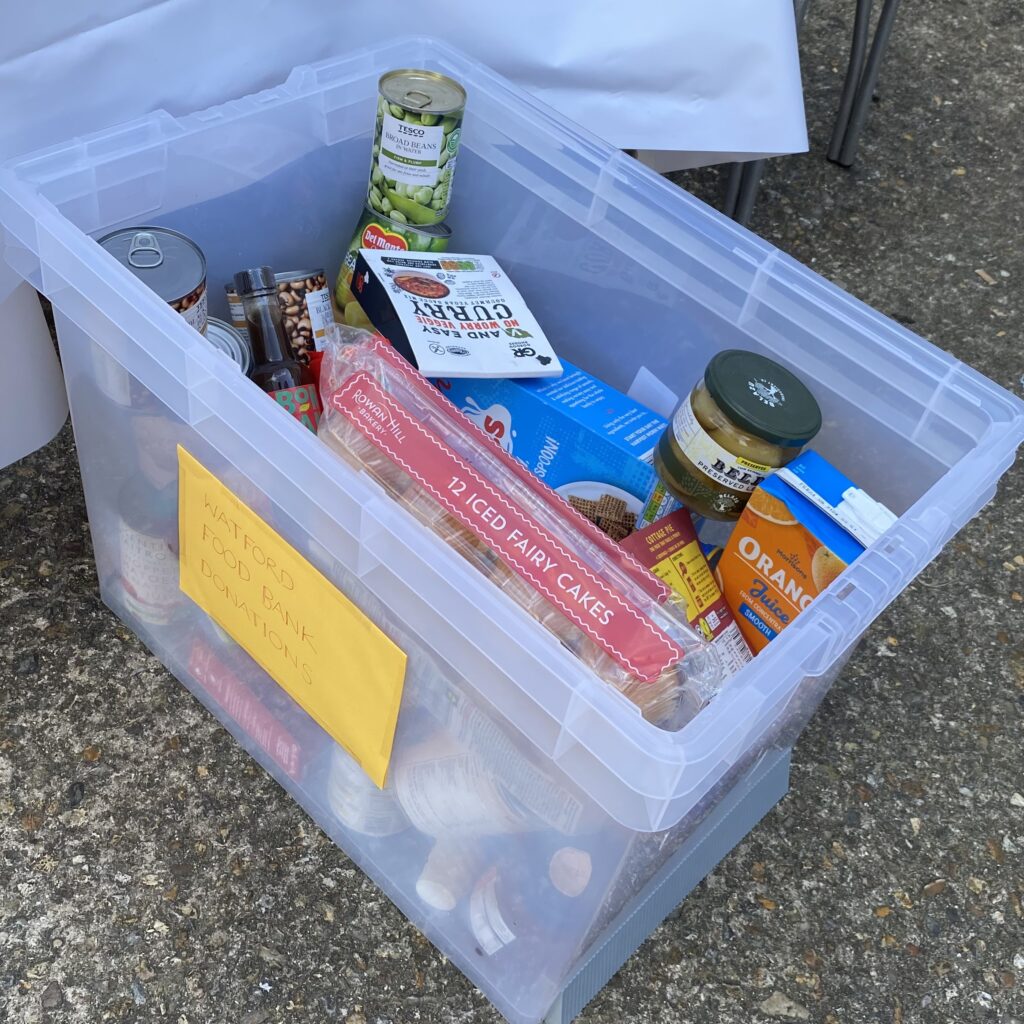 A donation to Watford Food Bank at OVEG's Oxhey Village Jumble Trail on 29 July 2023
