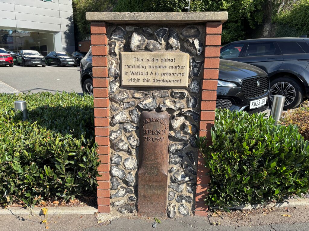 The Sparrows Herne Trust turnpike marker on Lower High Street, Watford